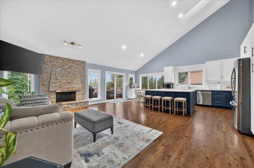 876 Shawnee Drive Sw, Calgary, AB - Indoor Photo Showing Living Room With Fireplace