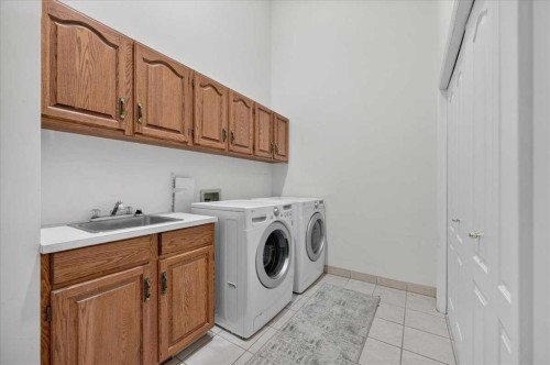 876 Shawnee Drive Sw, Calgary, AB - Indoor Photo Showing Laundry Room
