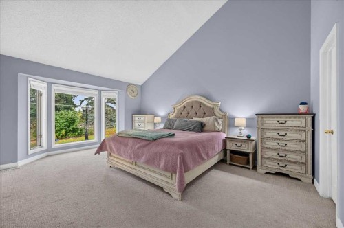 876 Shawnee Drive Sw, Calgary, AB - Indoor Photo Showing Bedroom