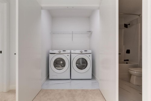 704 Sora Boulevard Se, Calgary, AB - Indoor Photo Showing Laundry Room