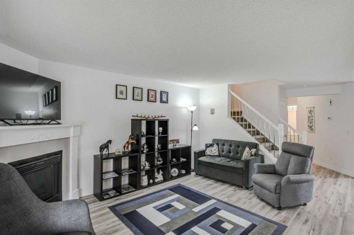 58 Sierra Morena Gardens Sw, Calgary, AB - Indoor Photo Showing Living Room With Fireplace