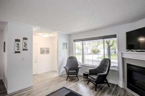 58 Sierra Morena Gardens Sw, Calgary, AB - Indoor Photo Showing Living Room With Fireplace