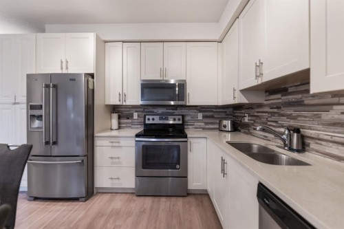 3108-99 Copperstone Park Se, Calgary, AB - Indoor Photo Showing Kitchen With Stainless Steel Kitchen With Double Sink