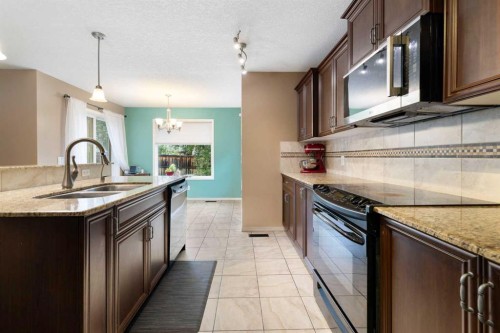 19 Silverado Skies Bay Sw, Calgary, AB - Indoor Photo Showing Kitchen With Double Sink