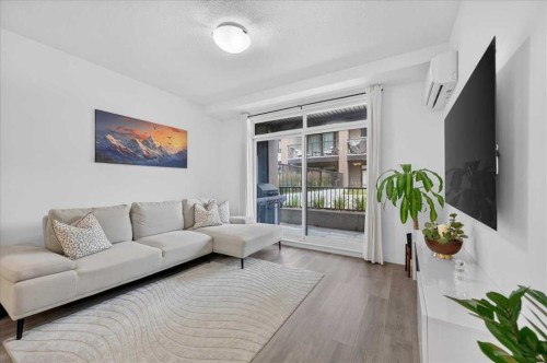4101-200 Seton Circle Se, Calgary, AB - Indoor Photo Showing Living Room