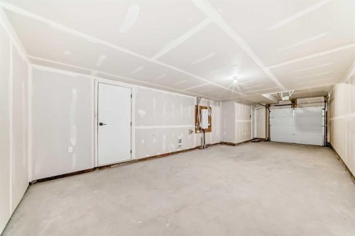 103 Osprey Hill Point Sw, Calgary, AB - Indoor Photo Showing Garage