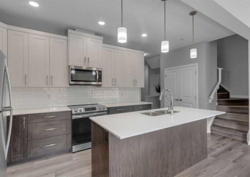 217 Lucas Crescent Nw, Calgary, AB - Indoor Photo Showing Kitchen With Stainless Steel Kitchen With Double Sink With Upgraded Kitchen