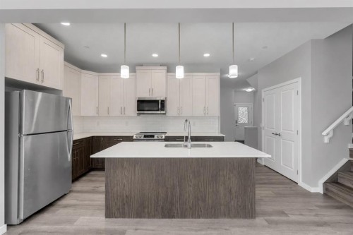 217 Lucas Crescent Nw, Calgary, AB - Indoor Photo Showing Kitchen With Stainless Steel Kitchen With Double Sink With Upgraded Kitchen