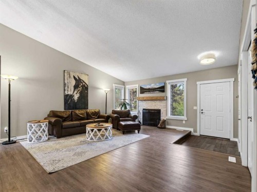 13704 Deer Run Boulevard Se, Calgary, AB - Indoor Photo Showing Living Room With Fireplace
