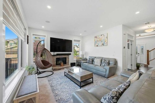 160 Panatella Crescent Nw, Calgary, AB - Indoor Photo Showing Living Room With Fireplace