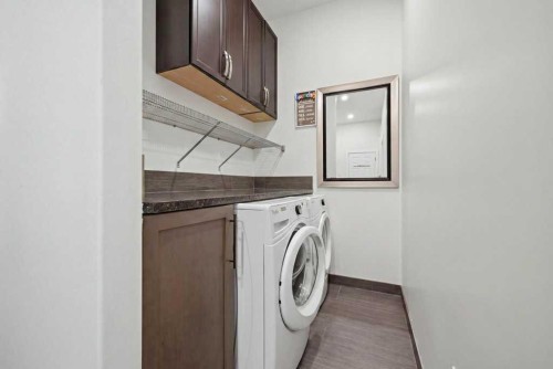 160 Panatella Crescent Nw, Calgary, AB - Indoor Photo Showing Laundry Room