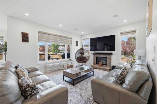 160 Panatella Crescent Nw, Calgary, AB - Indoor Photo Showing Living Room With Fireplace