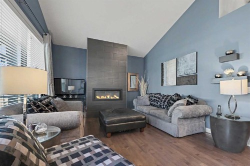59 Evanswood Circle Nw, Calgary, AB - Indoor Photo Showing Living Room With Fireplace