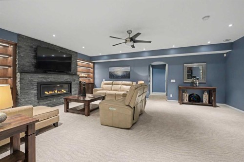 59 Evanswood Circle Nw, Calgary, AB - Indoor Photo Showing Living Room With Fireplace