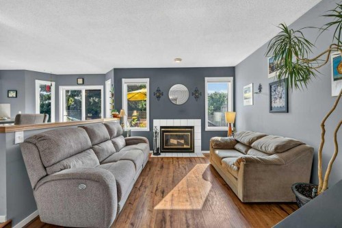 83 Millrise Crescent Sw, Calgary, AB - Indoor Photo Showing Living Room With Fireplace