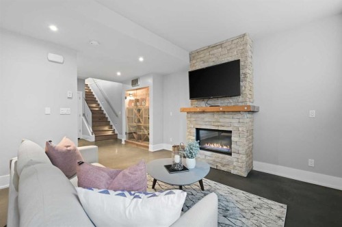 826 Durham Avenue Sw, Calgary, AB - Indoor Photo Showing Living Room With Fireplace