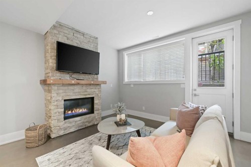 826 Durham Avenue Sw, Calgary, AB - Indoor Photo Showing Living Room With Fireplace