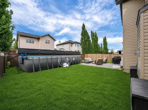 109 Seagreen Link, Chestermere, AB - Outdoor With Above Ground Pool
