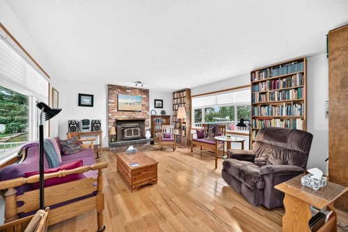 6203 Dalmarnock Green Nw, Calgary, AB - Indoor Photo Showing Living Room With Fireplace
