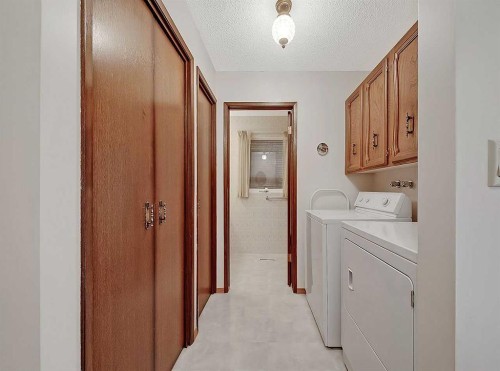 9556 Oakland Way Sw, Calgary, AB - Indoor Photo Showing Laundry Room