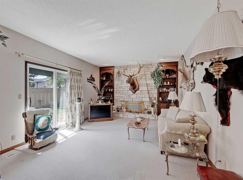 9556 Oakland Way Sw, Calgary, AB - Indoor With Fireplace