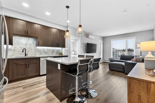 401-150 Shawnee Square Sw, Calgary, AB - Indoor Photo Showing Kitchen With Upgraded Kitchen