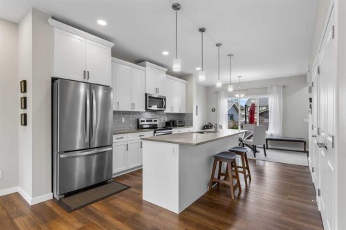 111 Hillcrest Close Sw, Airdrie, AB - Indoor Photo Showing Kitchen With Stainless Steel Kitchen With Upgraded Kitchen
