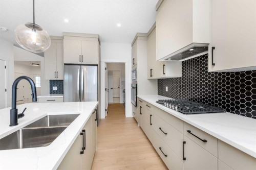 503 Rivercrest View, Cochrane, AB - Indoor Photo Showing Kitchen With Double Sink With Upgraded Kitchen