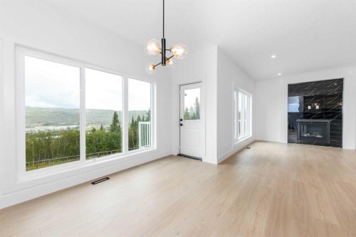503 Rivercrest View, Cochrane, AB - Indoor Photo Showing Living Room With Fireplace