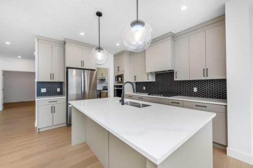 503 Rivercrest View, Cochrane, AB - Indoor Photo Showing Kitchen With Upgraded Kitchen
