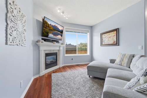 101 Sierra Morena Landing Sw, Calgary, AB - Indoor Photo Showing Living Room With Fireplace