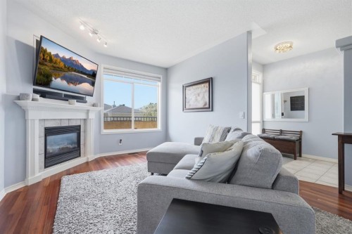 101 Sierra Morena Landing Sw, Calgary, AB - Indoor Photo Showing Living Room With Fireplace
