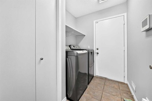 337 Harvest Lake Green Ne, Calgary, AB - Indoor Photo Showing Laundry Room