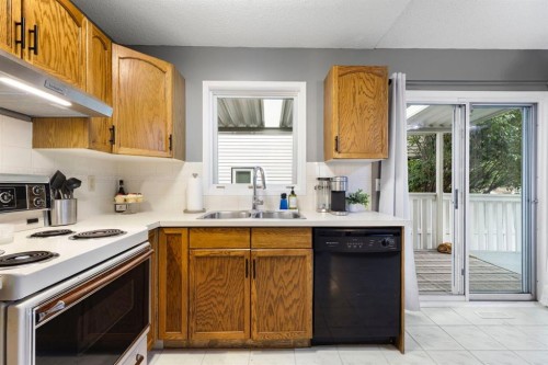 176 Riverbend Drive Se, Calgary, AB - Indoor Photo Showing Kitchen With Double Sink