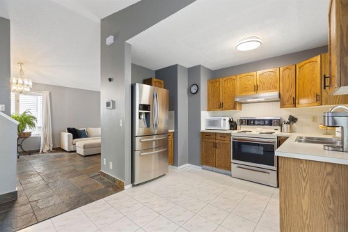 176 Riverbend Drive Se, Calgary, AB - Indoor Photo Showing Kitchen With Double Sink