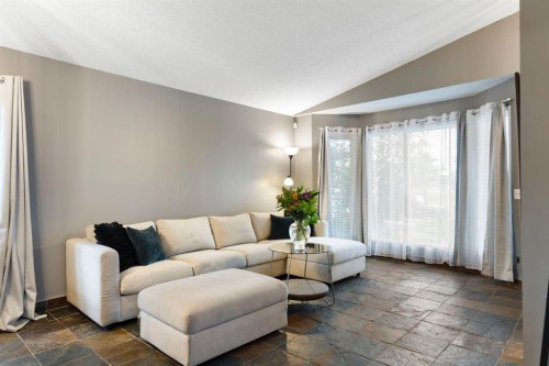 176 Riverbend Drive Se, Calgary, AB - Indoor Photo Showing Living Room