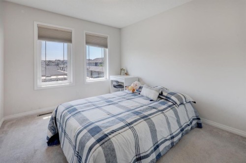 673 Hillcrest Road Sw, Airdrie, AB - Indoor Photo Showing Bedroom