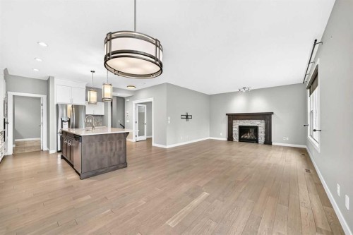 143 Stonemere Green, Chestermere, AB - Indoor With Fireplace