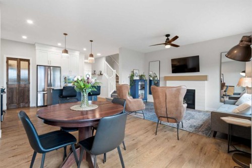 364 Fireside Way, Cochrane, AB - Indoor Photo Showing Dining Room With Fireplace