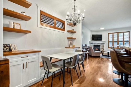 522 22 Avenue Ne, Calgary, AB - Indoor Photo Showing Dining Room With Fireplace