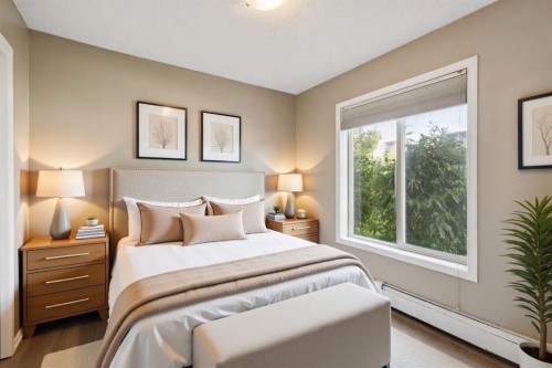 2117-403 Mackenzie Way Sw, Airdrie, AB - Indoor Photo Showing Bedroom