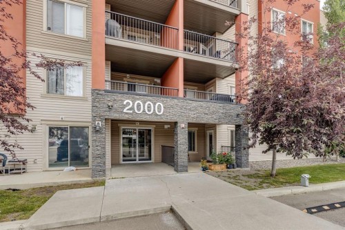 2117-403 Mackenzie Way Sw, Airdrie, AB - Outdoor With Facade