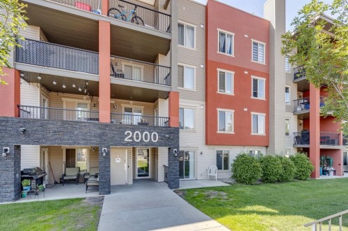 2117-403 Mackenzie Way Sw, Airdrie, AB - Outdoor With Facade