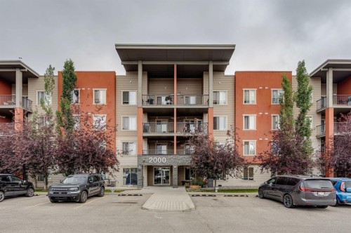2117-403 Mackenzie Way Sw, Airdrie, AB - Outdoor With Facade