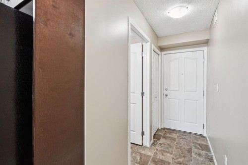 2117-403 Mackenzie Way Sw, Airdrie, AB - Indoor Photo Showing Other Room