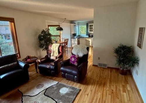 151 Riverside Mews Se, Calgary, AB - Indoor Photo Showing Living Room