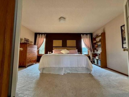 151 Riverside Mews Se, Calgary, AB - Indoor Photo Showing Bedroom