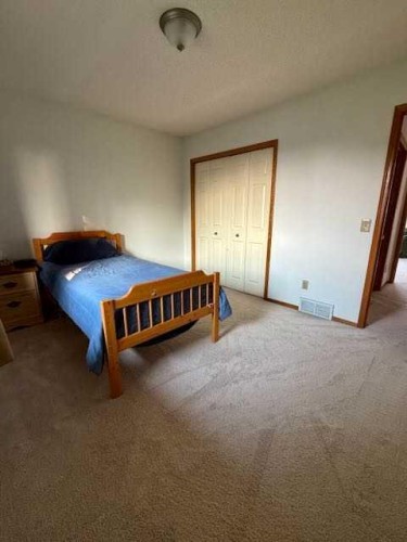 151 Riverside Mews Se, Calgary, AB - Indoor Photo Showing Bedroom