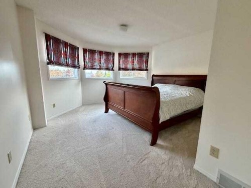 151 Riverside Mews Se, Calgary, AB - Indoor Photo Showing Bedroom
