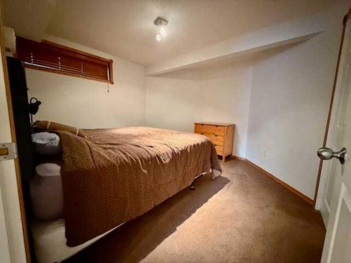 151 Riverside Mews Se, Calgary, AB - Indoor Photo Showing Bedroom